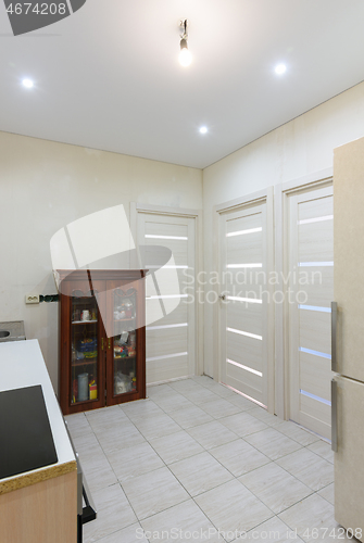 Image of Interior of a new living room kitchen with temporary furniture in a new building