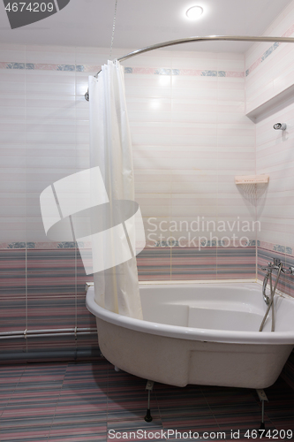 Image of View of the acrylic bathtub in the bathroom interior