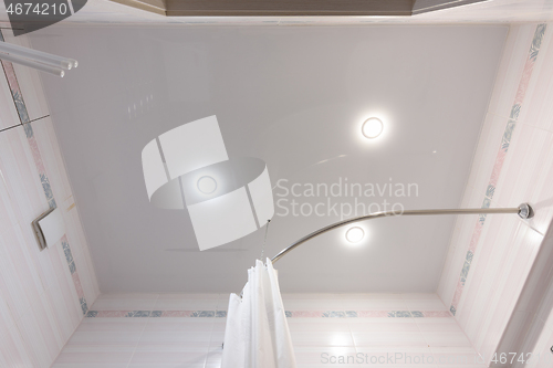 Image of Stretch ceiling with three spotlights in the bathroom