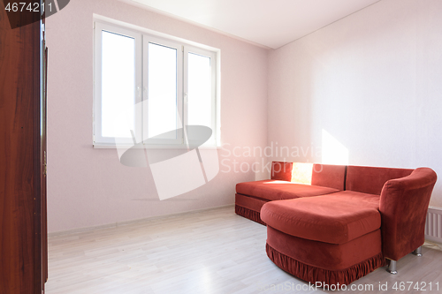 Image of Interior of a bright room with an old sofa in the bedroom