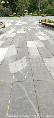 Image of Tiled square in the city park in summer day