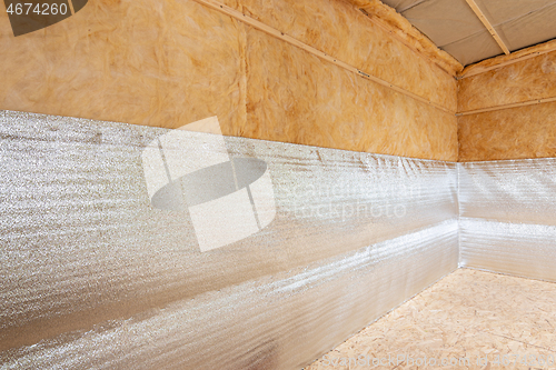 Image of Thermal insulation of a country house from reflective foamed polyethylene laminated with lavsan for house insulation