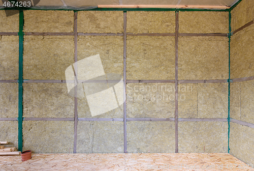 Image of Wall of a frame house from the inside insulated with mineral wool