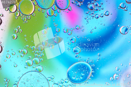 Image of Defocused multicolored abstract background picture made with oil, water and soap with mooving boubbles