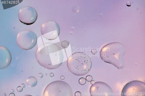 Image of Defocused pastel colored abstract background picture made with oil, water and soap