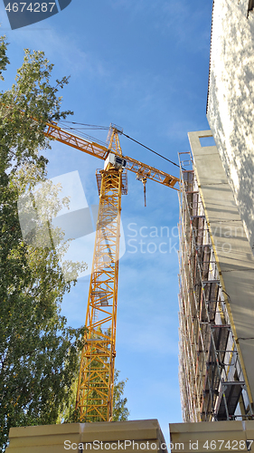 Image of Construction site with crane and building
