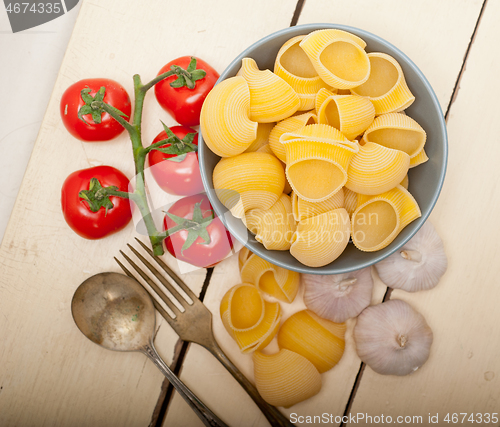 Image of Italian snail lumaconi pasta with tomatoes