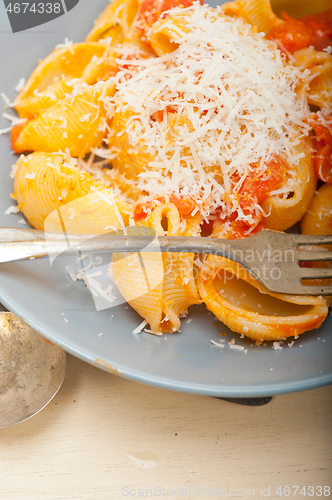 Image of Italian snail lumaconi pasta with tomatoes