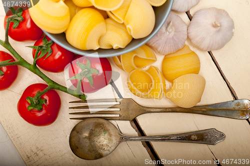 Image of Italian snail lumaconi pasta with tomatoes