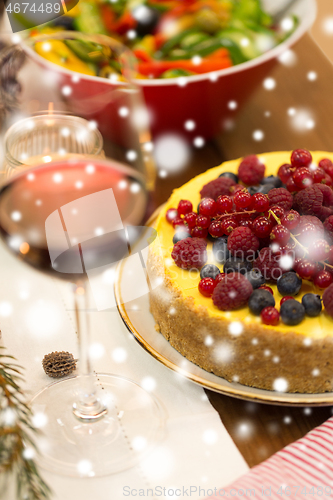 Image of close up of cake and other food on christmas table