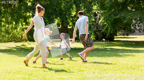 Image of happy family playing at summer park