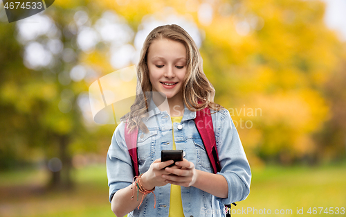 Image of teen student girl with school bag and smartphone