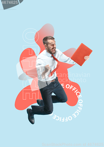 Image of Happy businessman jumping and holding laptop