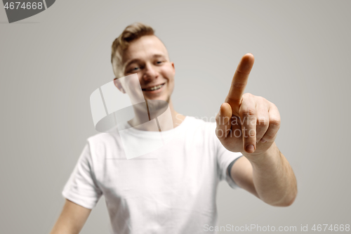 Image of Businessman hand touching empty virtual screen