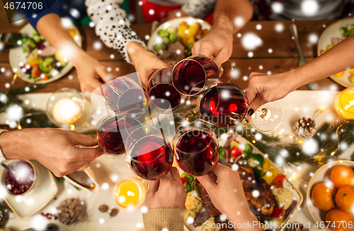 Image of close up of friends with wine celebrate christmas