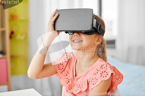 Image of girl in vr glasses at home