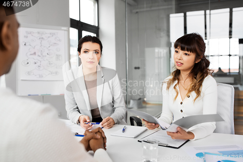 Image of recruiters having job interview with employee