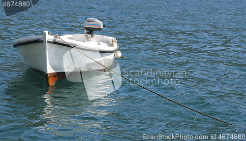 Image of Small sea boat achored in the bay