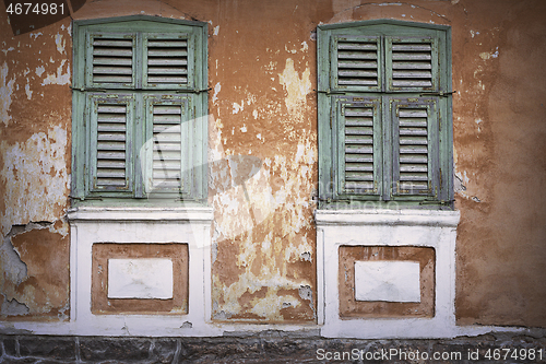 Image of green wooden shutters close up