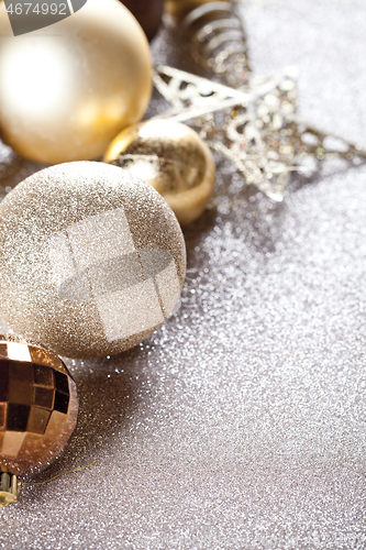 Image of Golden decorations closeup on glitter background.