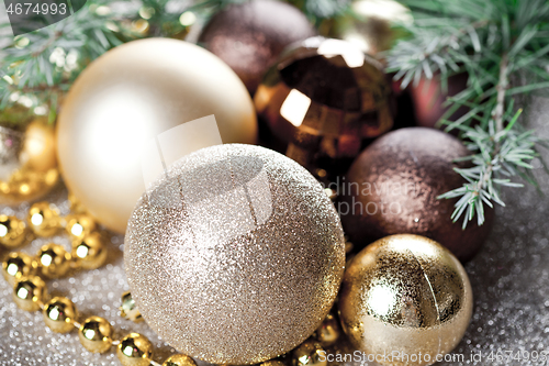Image of Christmas decorations and evergreen fir tree branch.