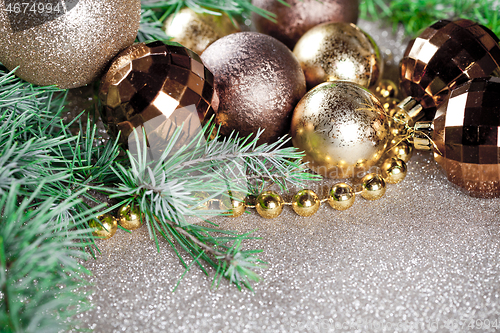 Image of Christmas decorations and evergreen fir tree branch.