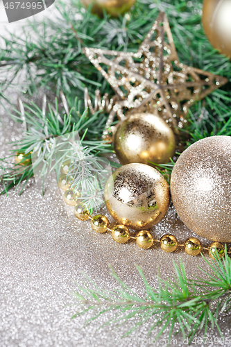 Image of Christmas decorations and evergreen fir tree branch.