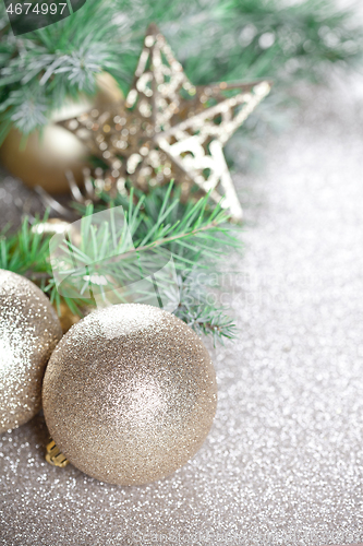 Image of Christmas decorations and evergreen fir tree branch.