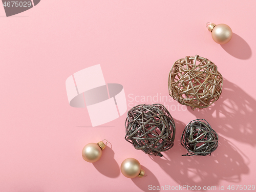 Image of christmas decorations on pink background