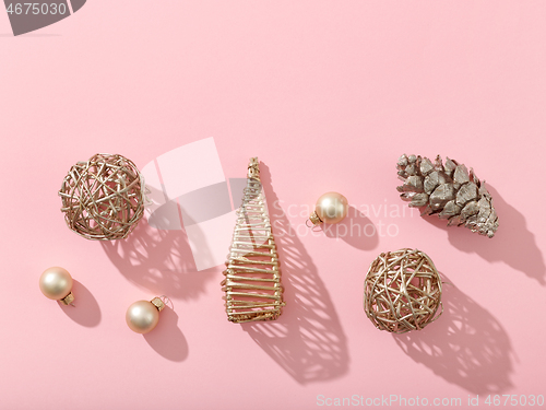 Image of christmas decorations on pink background