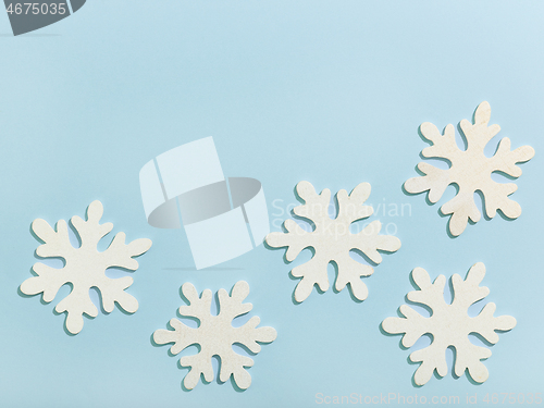 Image of christmas background with wooden snowflakes