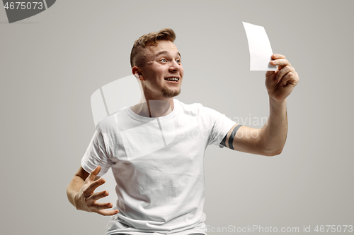 Image of Young man with a surprised expression won a bet