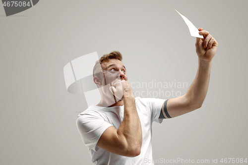 Image of Young man with a surprised expression won a bet