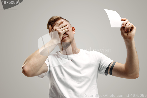 Image of Young man with a surprised expression won a bet