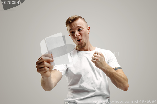 Image of Young man with a surprised expression won a bet