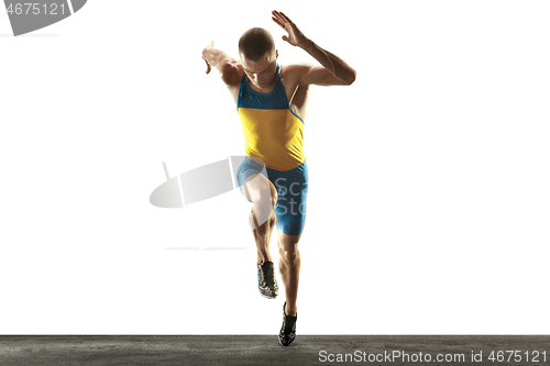 Image of Young caucasian man running or jogging isolated on white studio background.