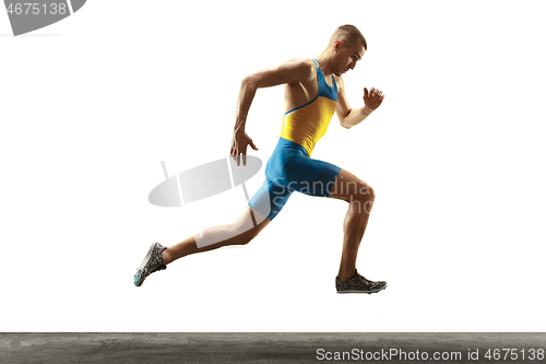 Image of Young caucasian man running or jogging isolated on white studio background.