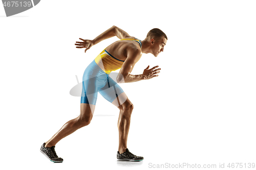 Image of Young caucasian man running or jogging isolated on white studio background.