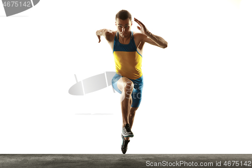 Image of Young caucasian man running or jogging isolated on white studio background.