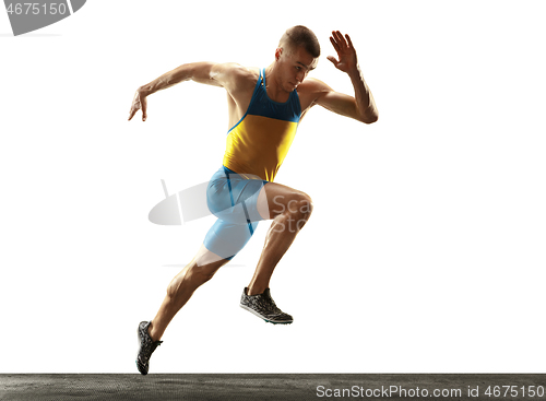 Image of Young caucasian man running or jogging isolated on white studio background.