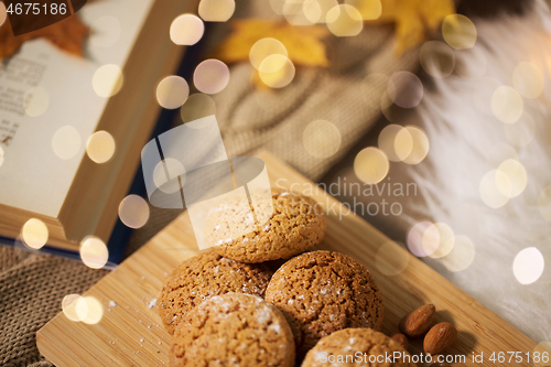 Image of oatmeal cookies on wooden board at home