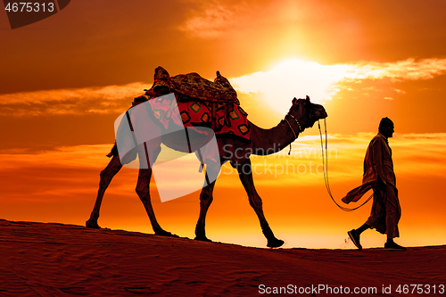 Image of Cameleers, camel Drivers at sunset. Thar desert on sunset Jaisal