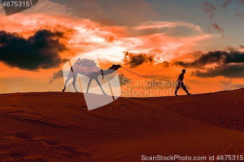 Image of Cameleers, camel Drivers at sunset. Thar desert on sunset Jaisal