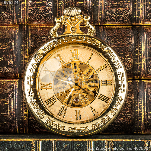 Image of Antique clock dial close-up. Vintage pocket watch.