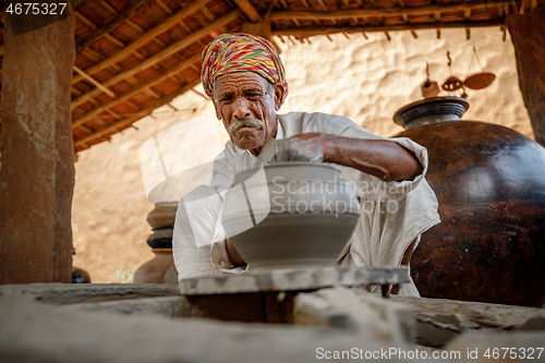 Image of Potter at work makes ceramic dishes. India, Rajasthan.