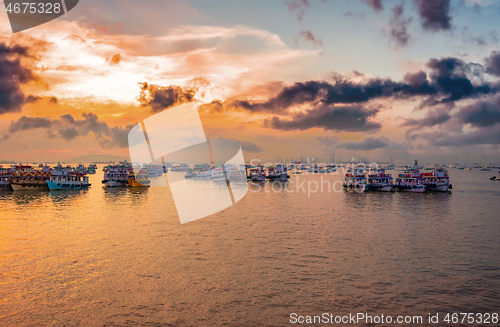 Image of Boats on Mumbai water at dawn. Colaba region of Mumbai, Maharash