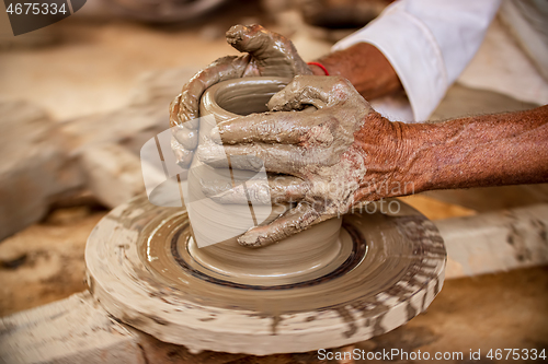 Image of Potter at work makes ceramic dishes. India, Rajasthan.