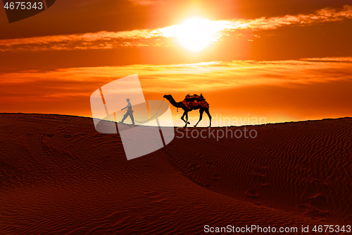 Image of Cameleers, camel Drivers at sunset. Thar desert on sunset Jaisal