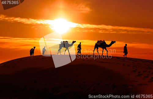 Image of Cameleers, camel Drivers at sunset. Thar desert on sunset Jaisal