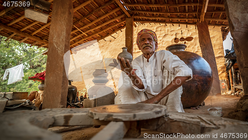 Image of Potter at work makes ceramic dishes. India, Rajasthan.